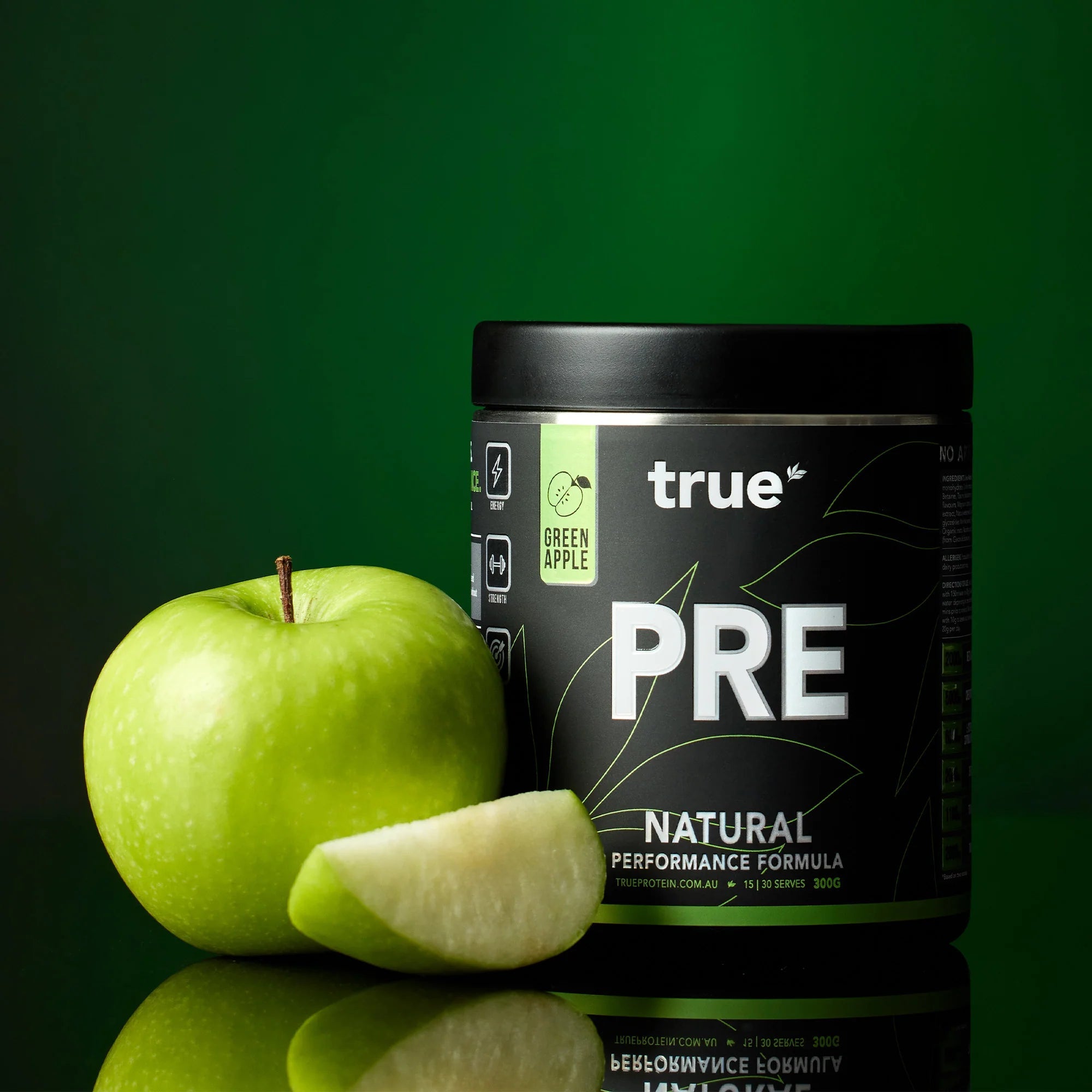 True Protein PRE Natural performance pre-workout powder - Green Apple flavor 300g tub with whole and sliced green apple on dark green background, Australia product image