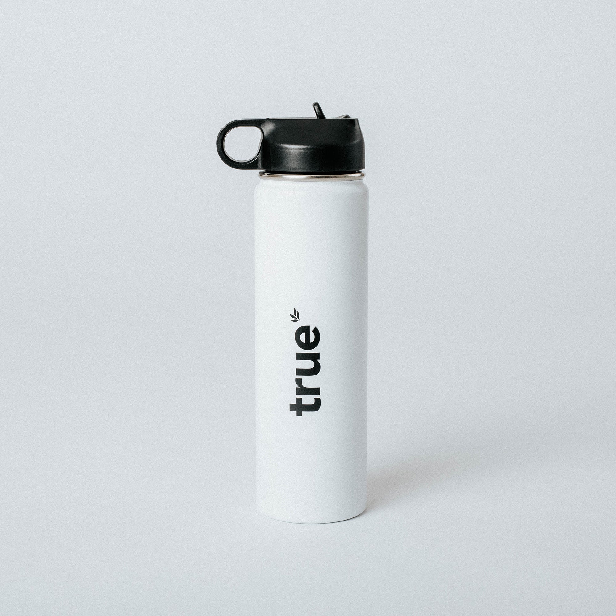 White insulated stainless steel water bottle with black flip-top lid and vertical "true" logo — minimalist studio product photo on white background