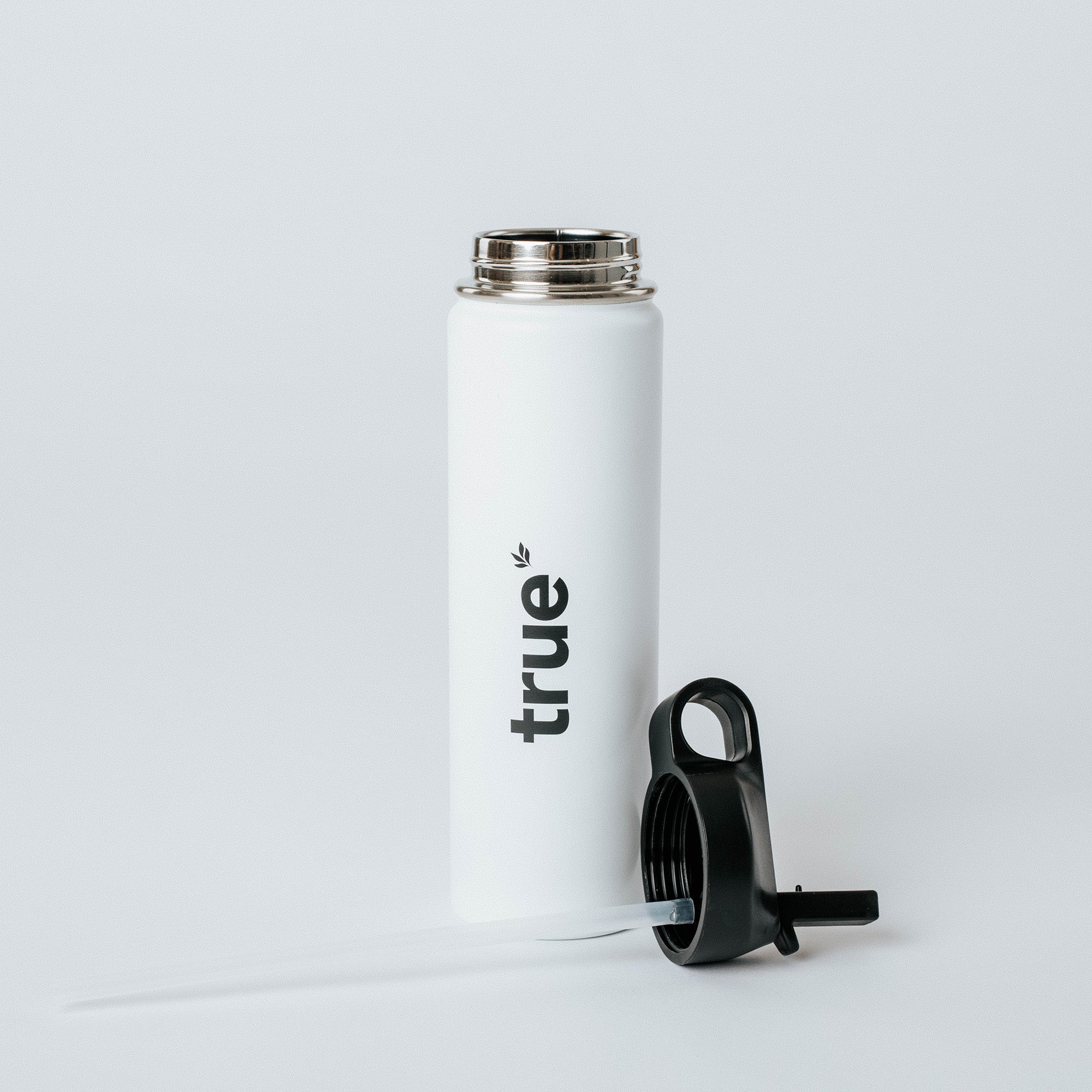White insulated stainless-steel water bottle with vertical "true" logo and detached black straw screw lid — reusable insulated travel water bottle product photo on white background