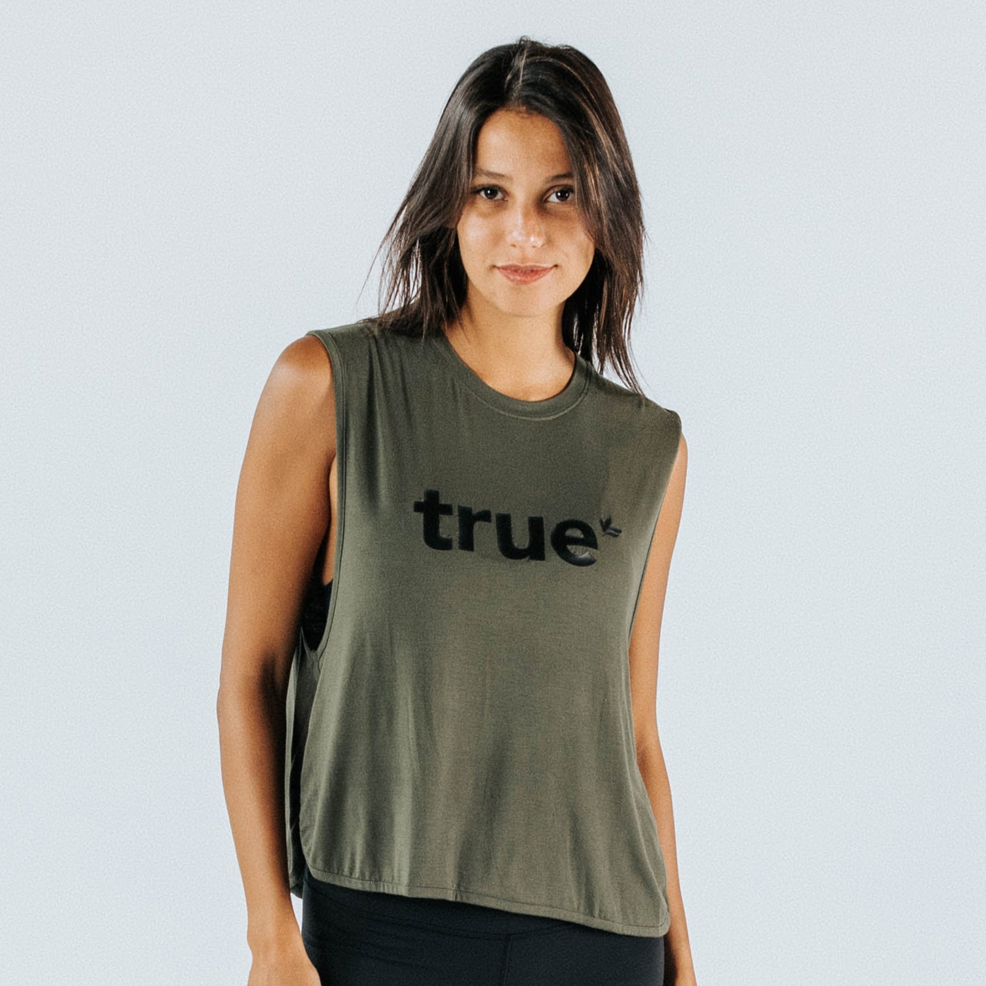 Woman wearing khaki sleeveless women&