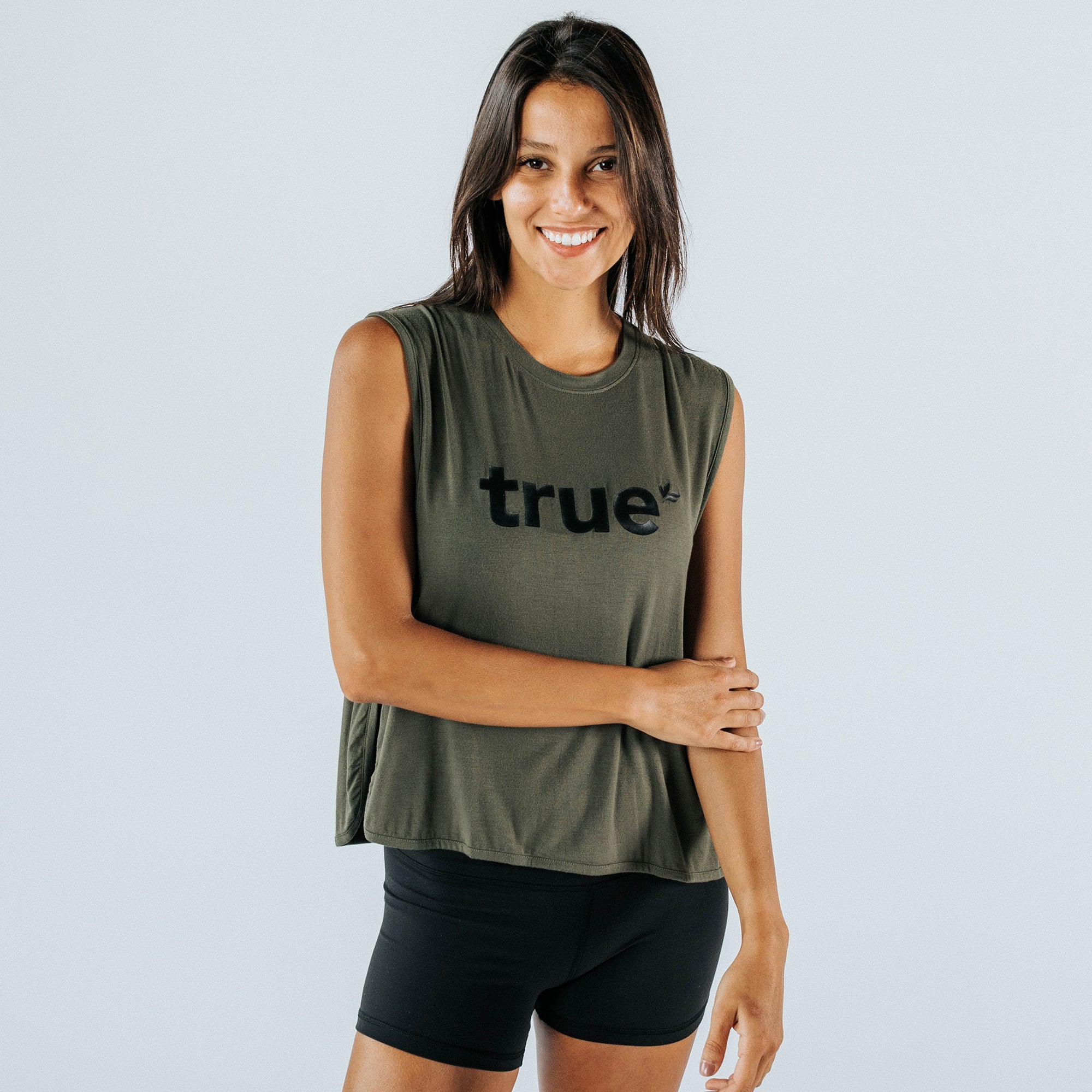 Smiling female model wearing a khaki women&