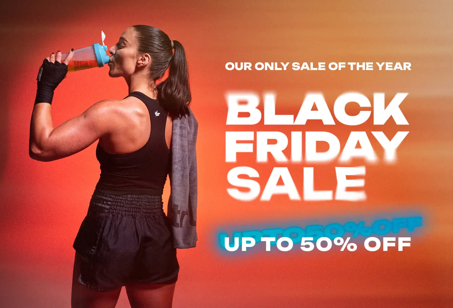 Athletic woman drinking from a gym shaker bottle with towel over her shoulder, wearing black workout top and shorts, orange gradient Black Friday sale banner reading "BLACK FRIDAY SALE – UP TO 50% OFF" for online fitness gear and activewear promotion.